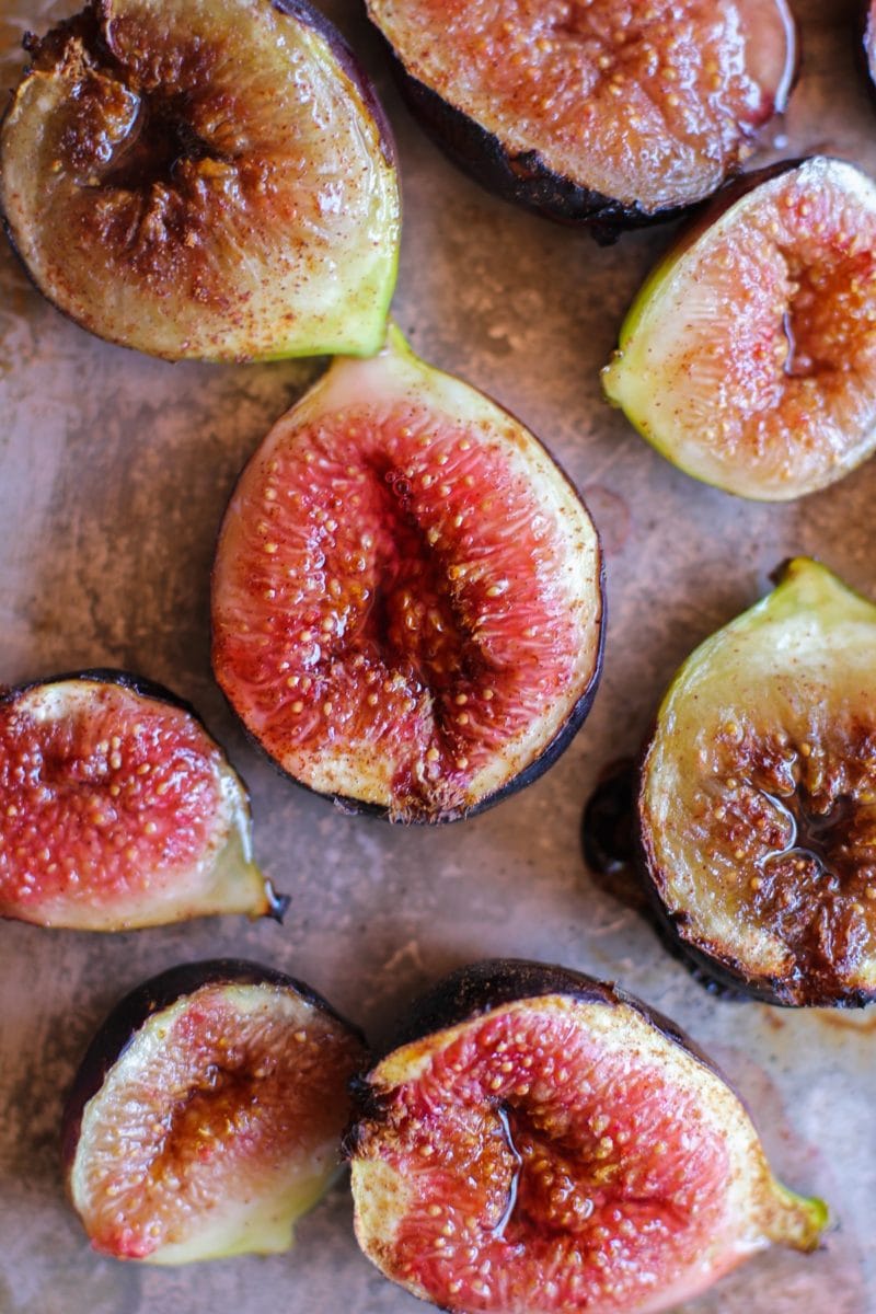 Roasted figs on a baking sheet fresh out of the oven and juicy.