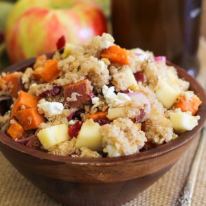 Large wooden bowl full of sweet potato quinoa salad