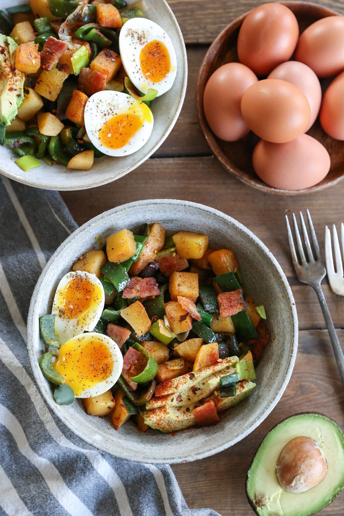 Two bowls of rutabaga hash with chilies and 6-minute eggs for breakfast.