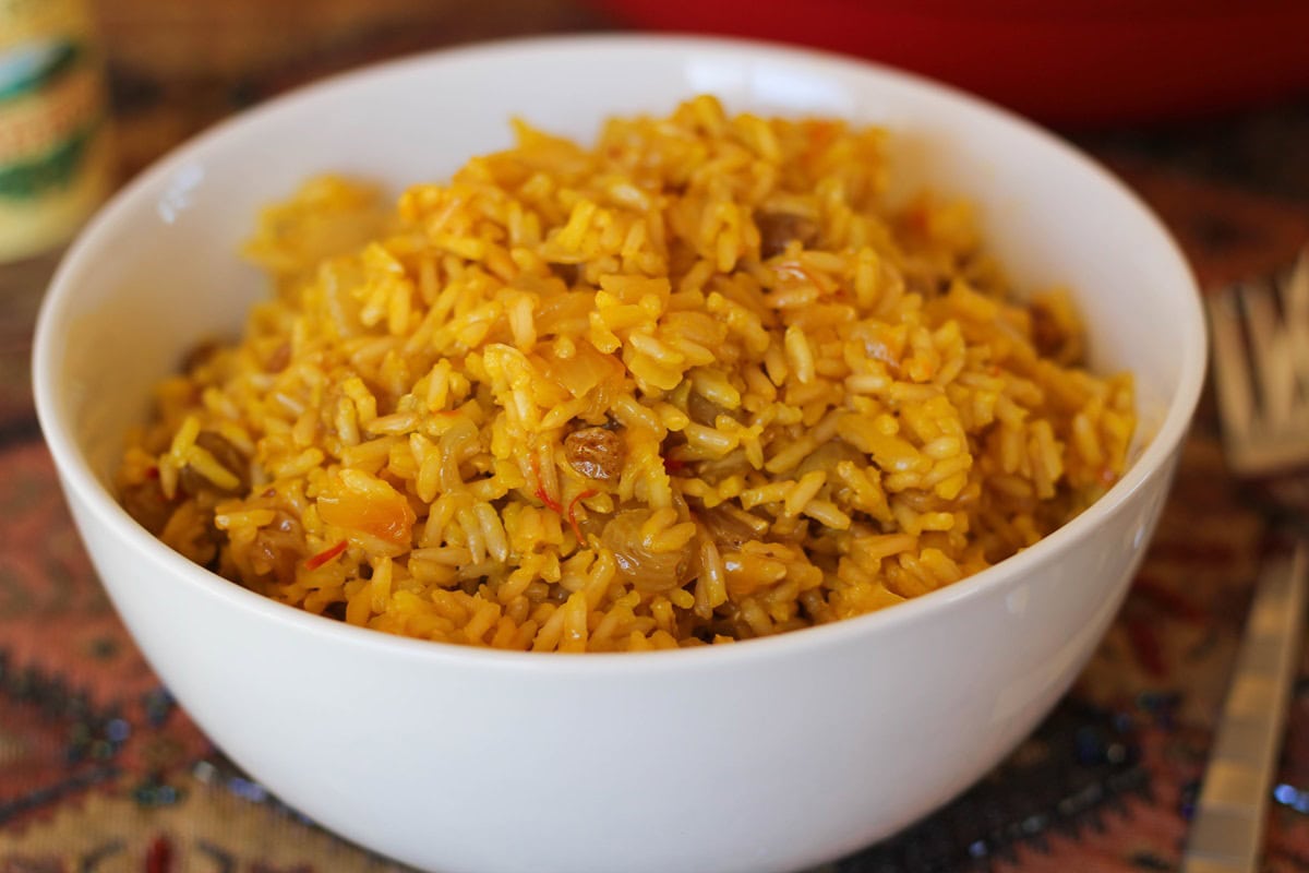 White bowl full of saffron rice