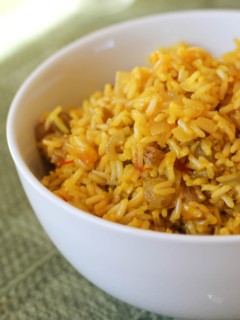 Big bowl full of saffron rice, ready to serve with a main dish.