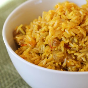 Big bowl full of saffron rice, ready to serve with a main dish.
