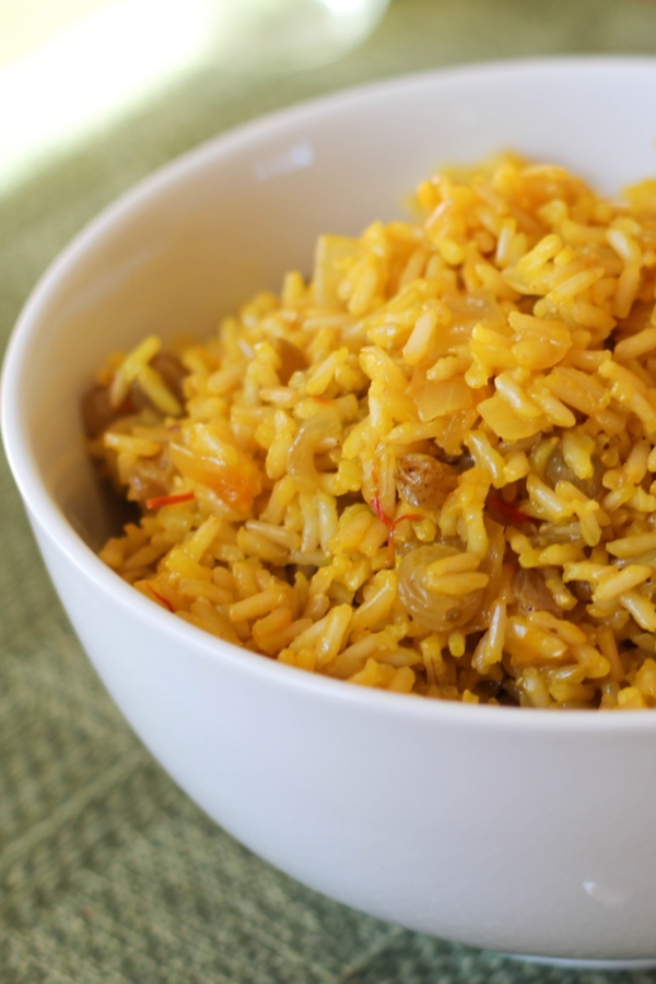 Big bowl full of saffron rice, ready to serve with a main dish.