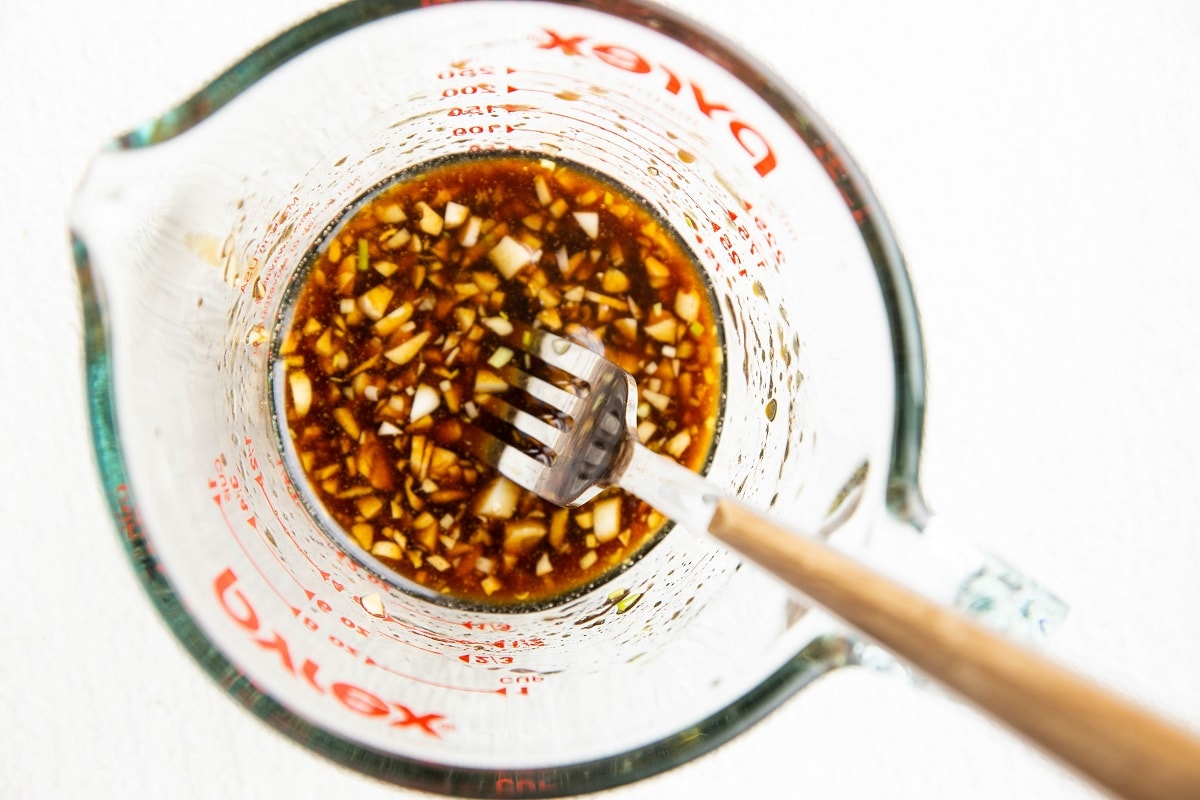 Marinade for salmon bites in a measuring cup.