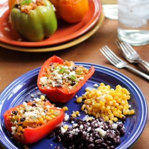 Stuffed bell peppers on a plate, cut in half
