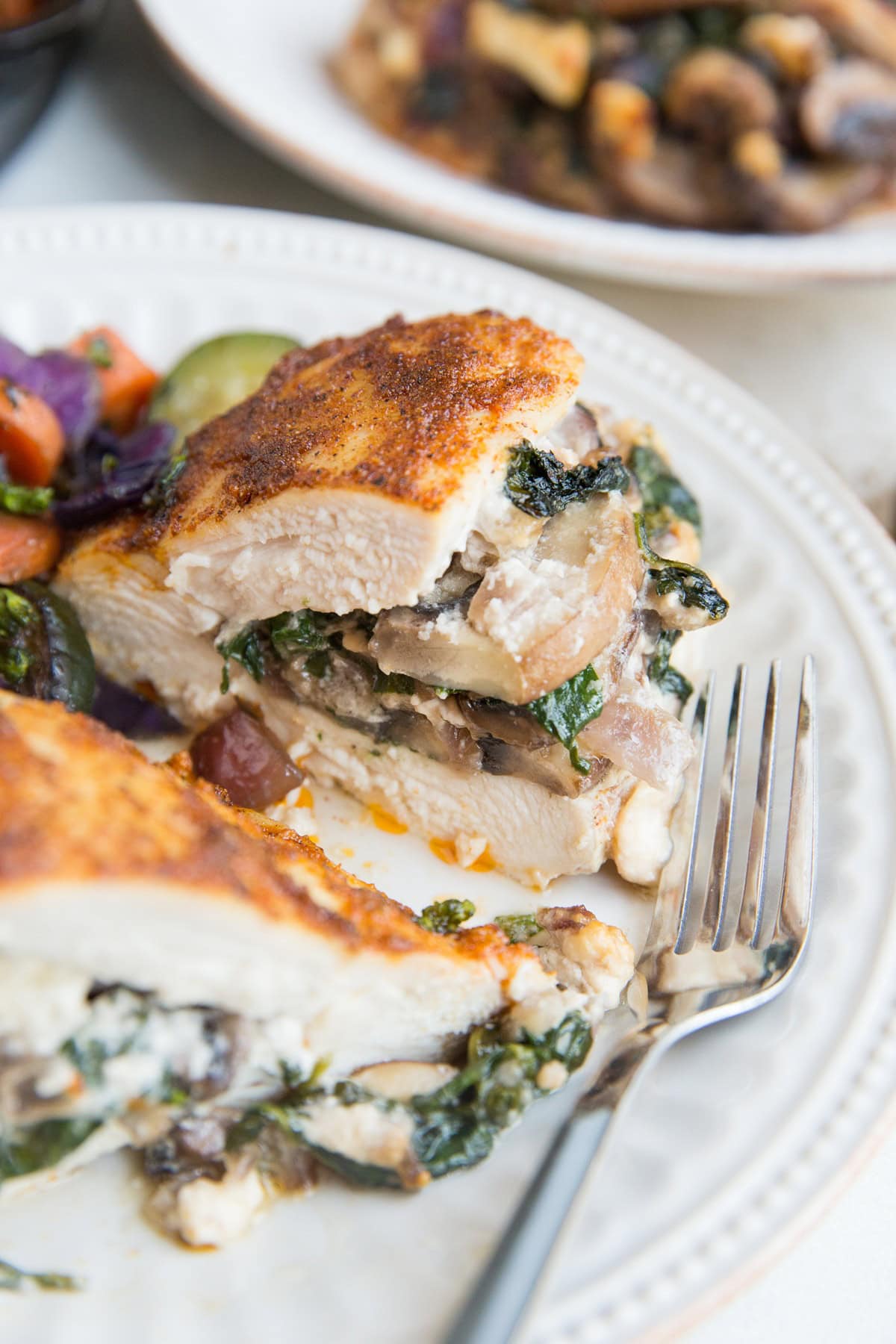 Quick and easy Stuffed Chicken Breast with mushrooms, spinach and feta. A delicious, healthy dinner recipe