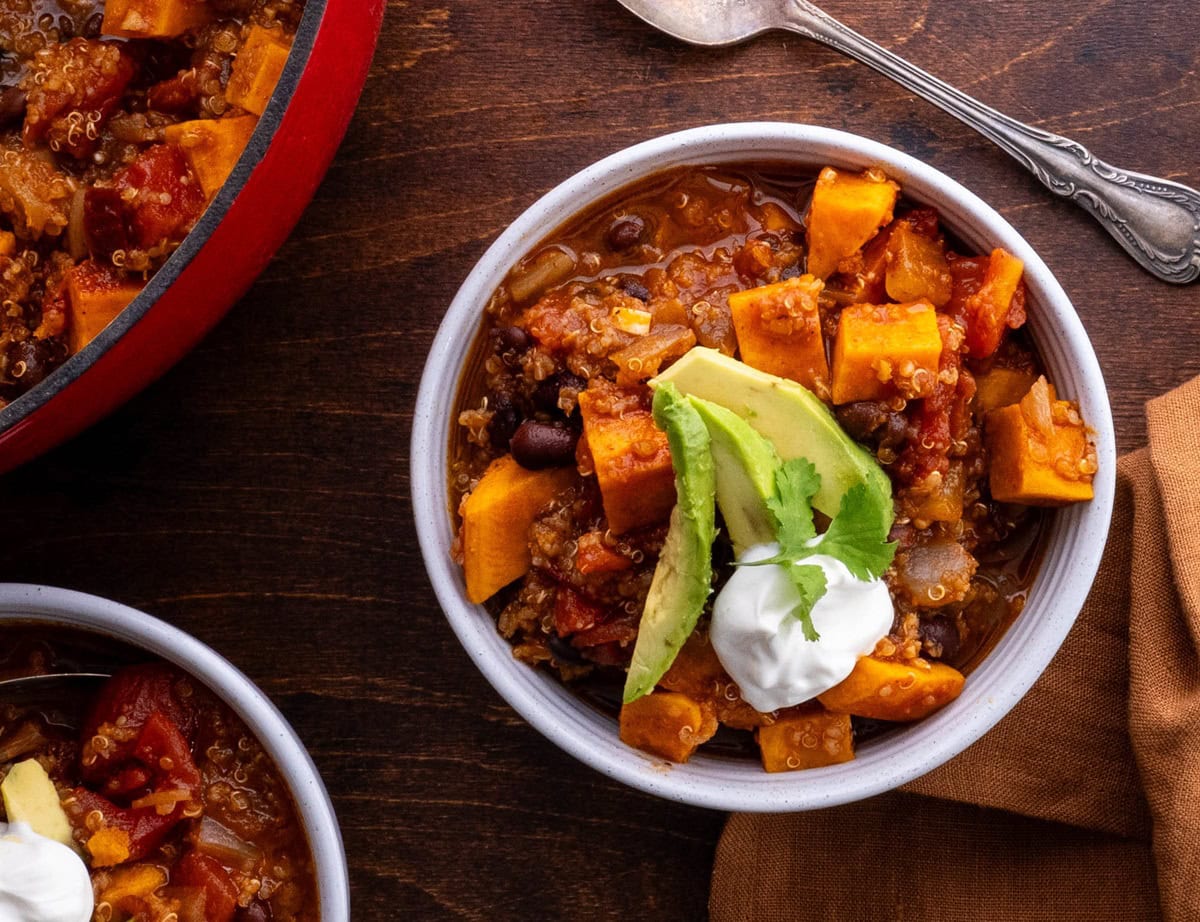 Sweet potato quinoa black bean chili in bowls, ready to serve.