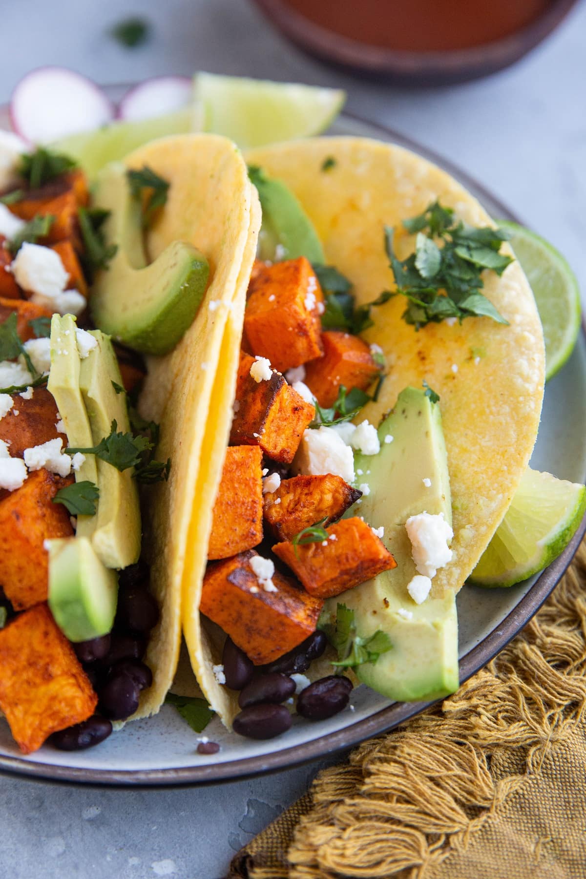 Large vegetarian tacos on a plate, ready to serve.