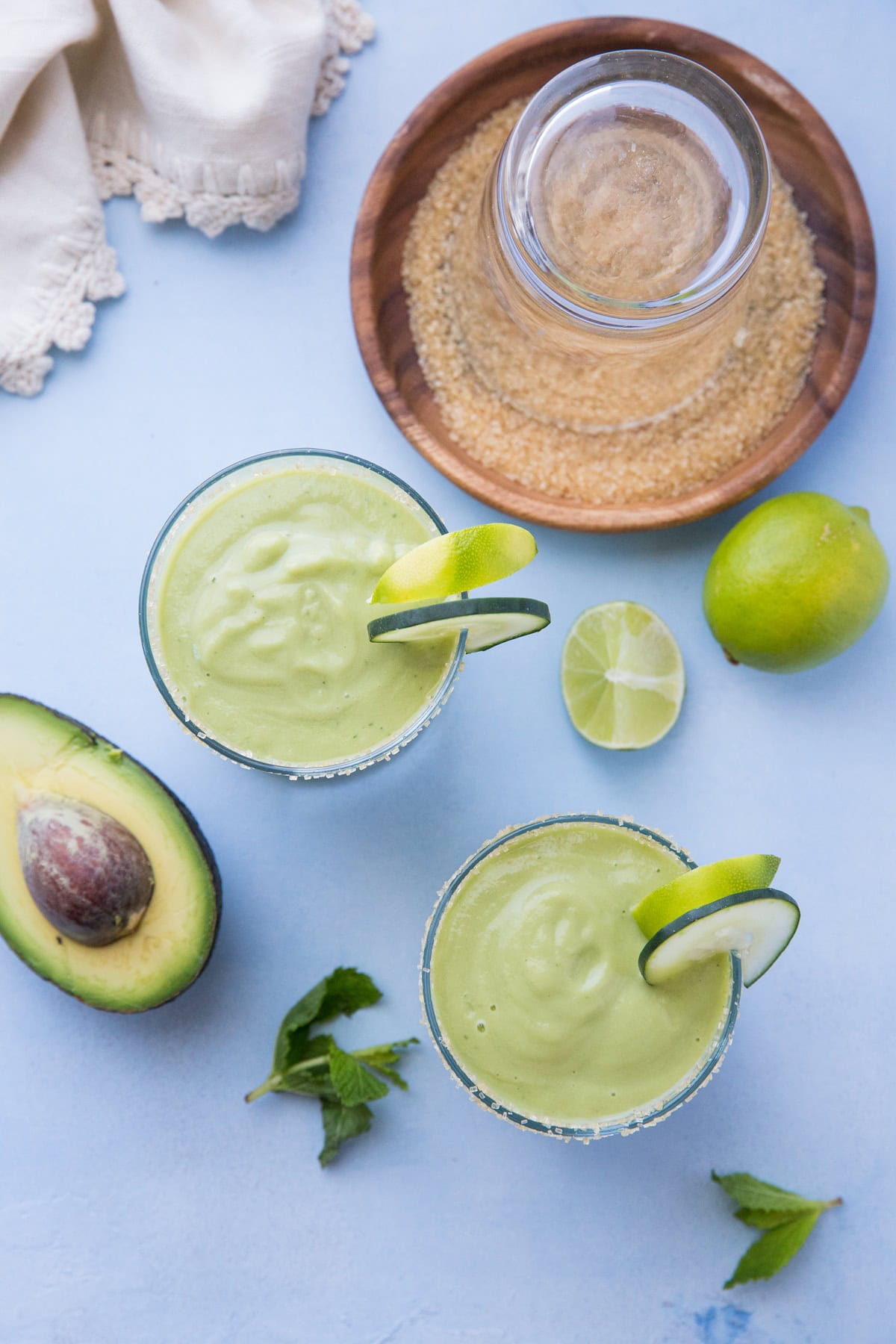 Tropical Avocado Cocktail with mango, pineapple juice, coconut milk, cucumber, mint and lime. These healthy refined sugar-free cocktails are refreshing and delicious!