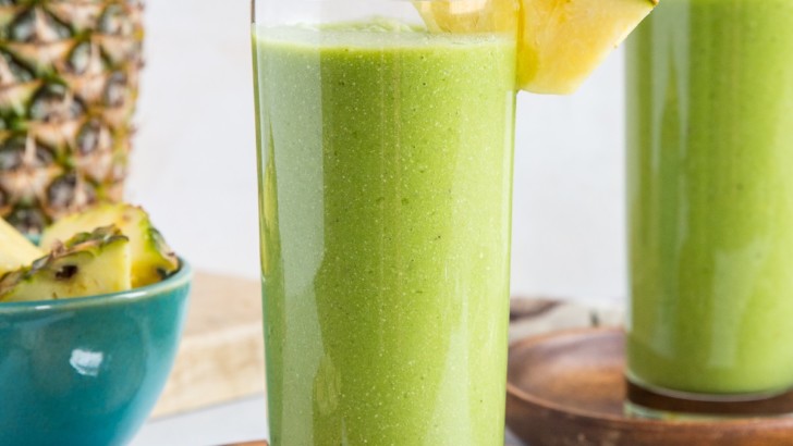 Two glasses of pineapple green protein smoothie