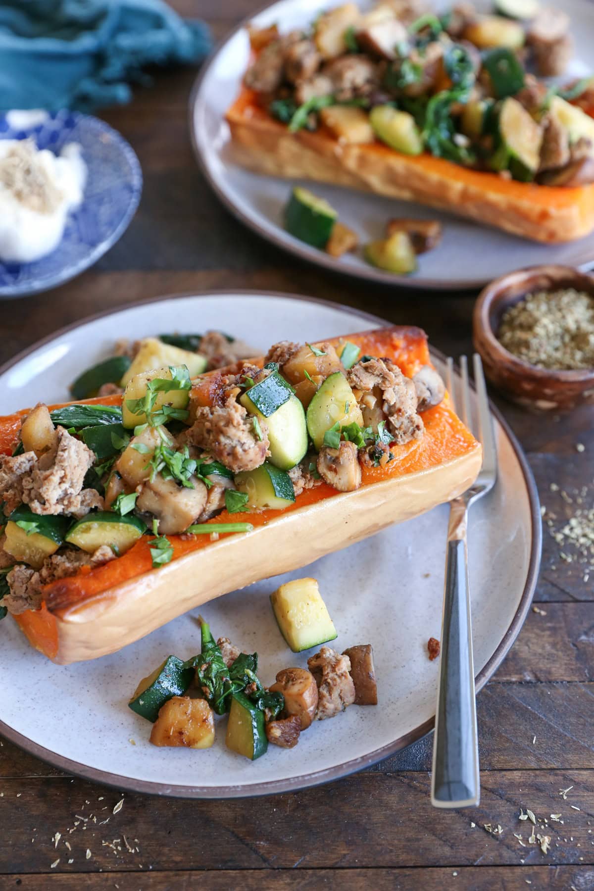 Halved butternut squash stuffed with ground turkey, zucchini, onions, mushrooms, etc.