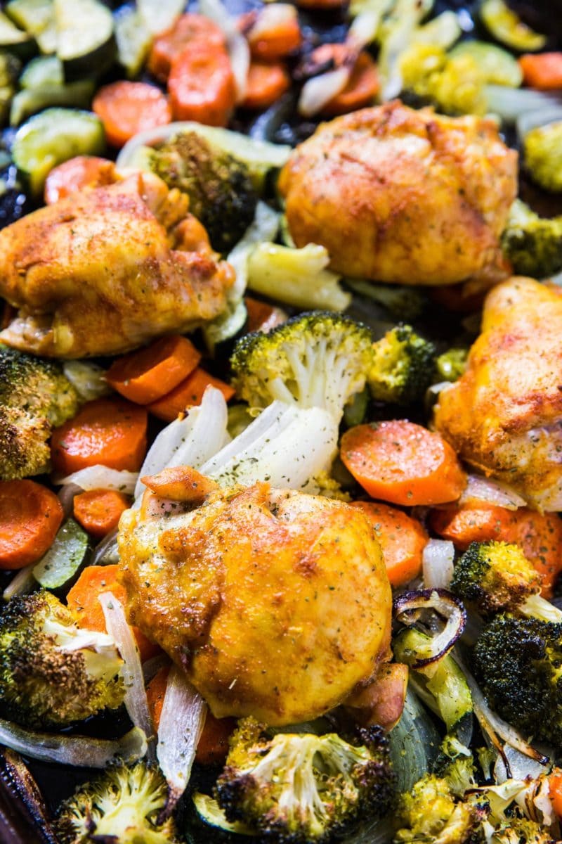 Turmeric Chicken Sheet Pan Dinner with vegetables and seasonings.