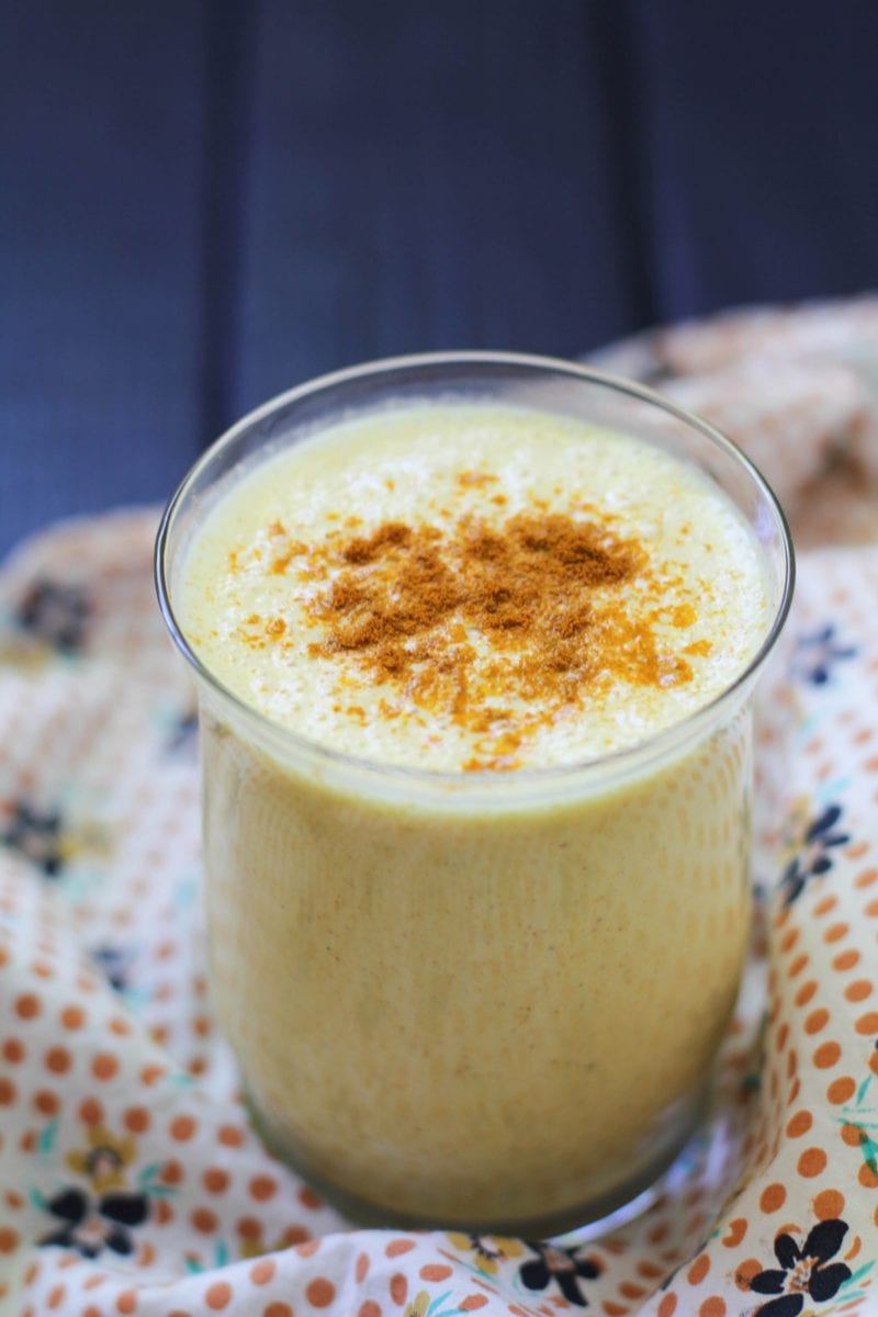 Glass of turmeric lassi with a napkin