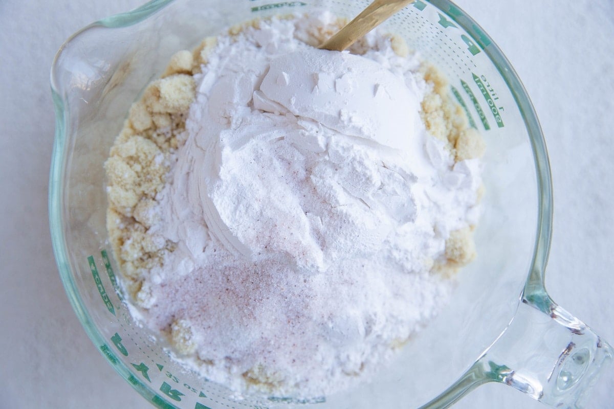 Dry ingredients for lemon cake in a large measuring cup.