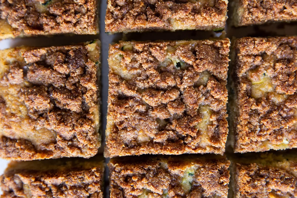 Square slices of zucchini crumb cake.