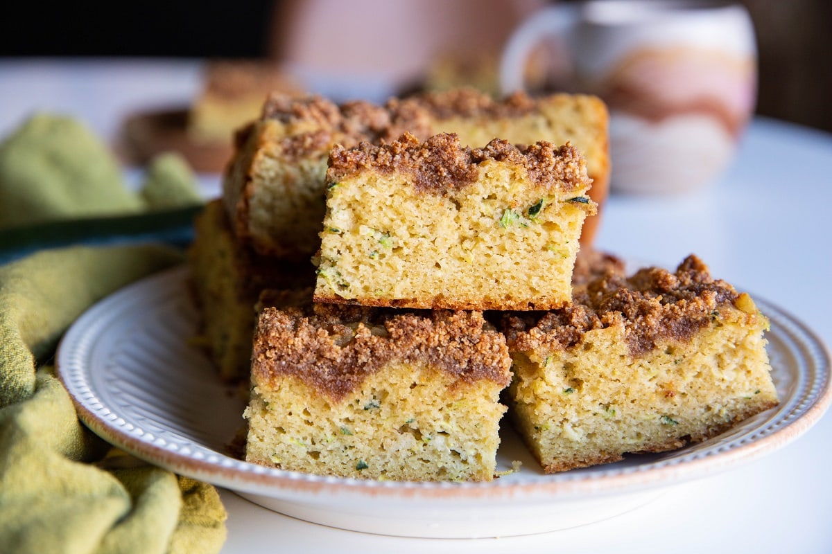 White plate with a stack of zucchini cake slices.