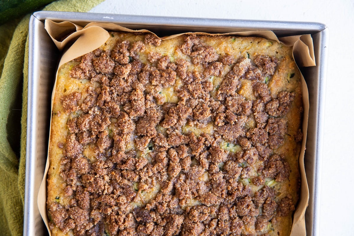 Zucchini cake fresh out of the oven in a cake pan.