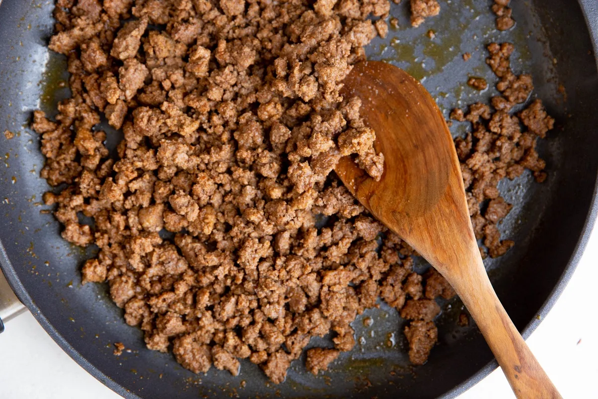 Ground beef cooked in a skillet.