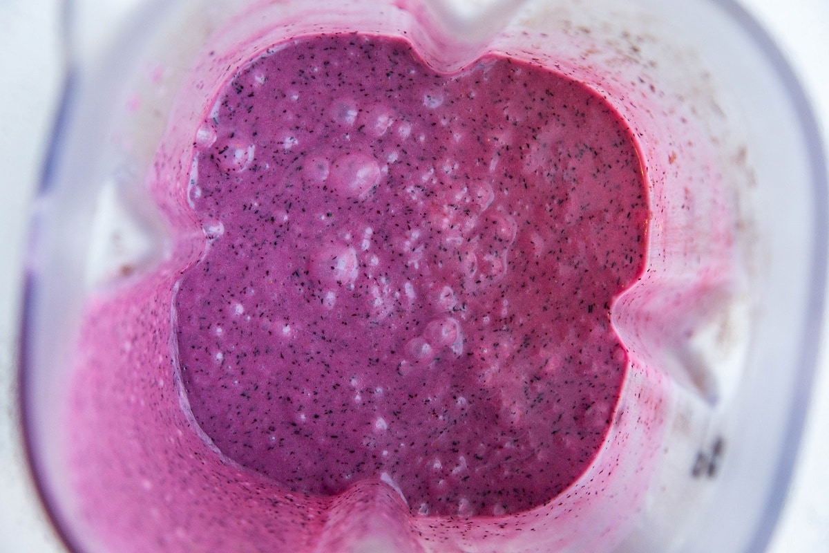 Blueberry popsicle mixture blended in a blender