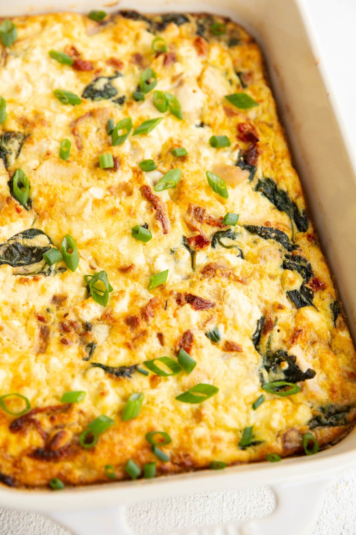 Chicken and spinach egg casserole fresh out of the oven, ready to serve.