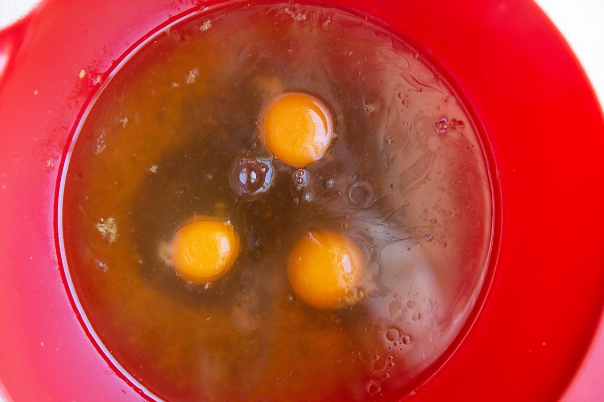 Wet ingredients for cake in a mixing bowl.