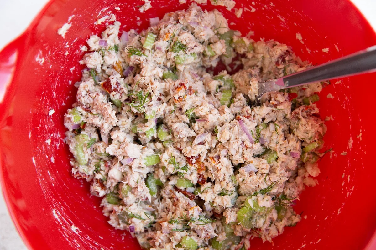 Tuna salad mixed up in a mixing bowl, ready to use.