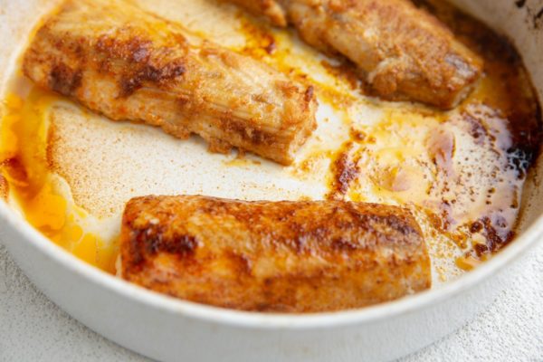 Baked mahi mahi fillets in a baking dish, fresh out of the oven.