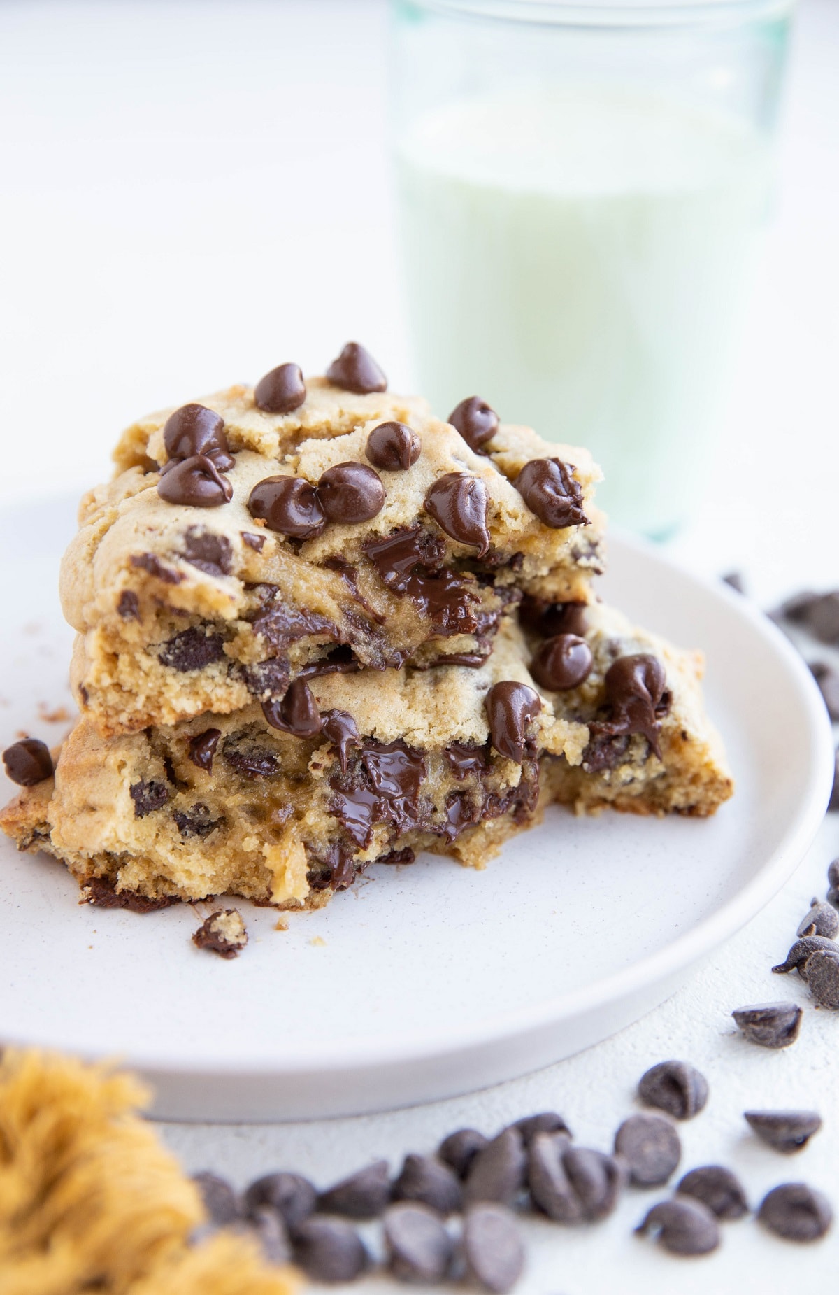 Gluten-free cookie that's been broken in half and stacked on top of each other on a plate.