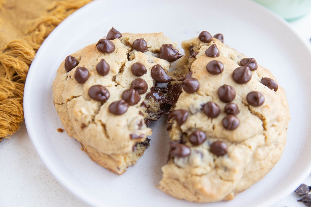 One huge cookie broken in half so you can see the gooey inside.