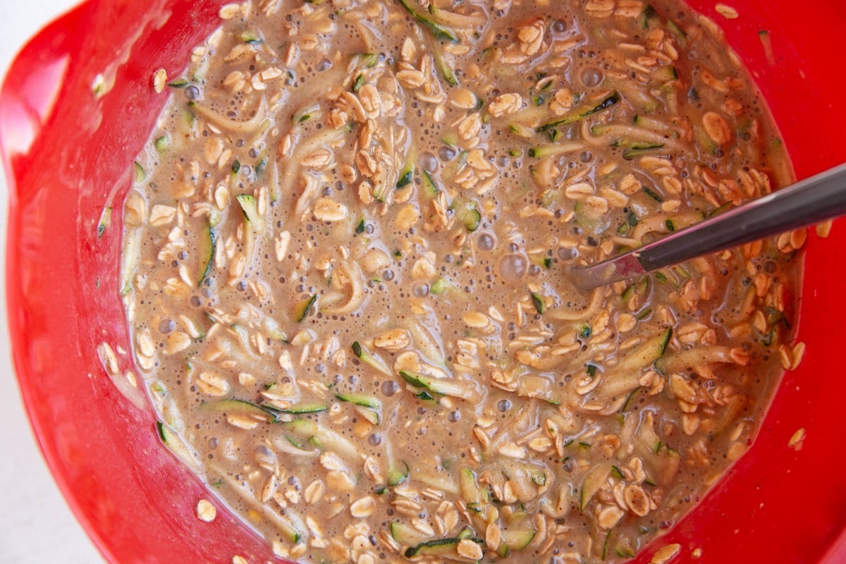 Zucchini baked oatmeal mixture in a mixing bowl, ready to bake.