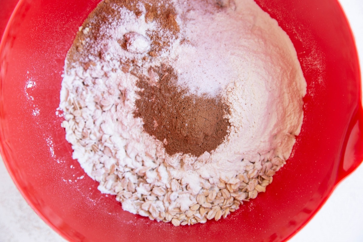 Dry ingredients for zucchini oatmeal bake in a mixing bowl.