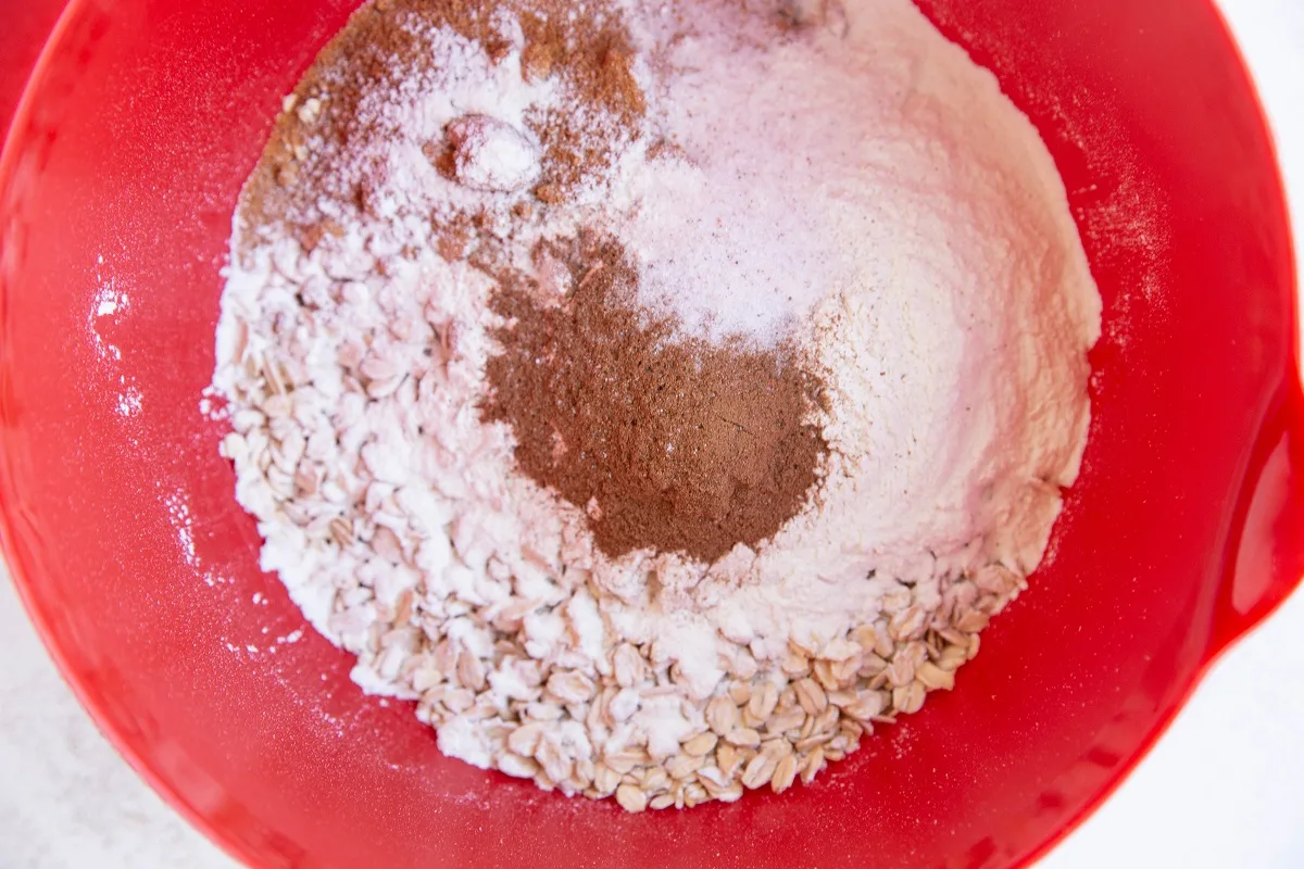 Dry ingredients for zucchini oatmeal bake in a mixing bowl.