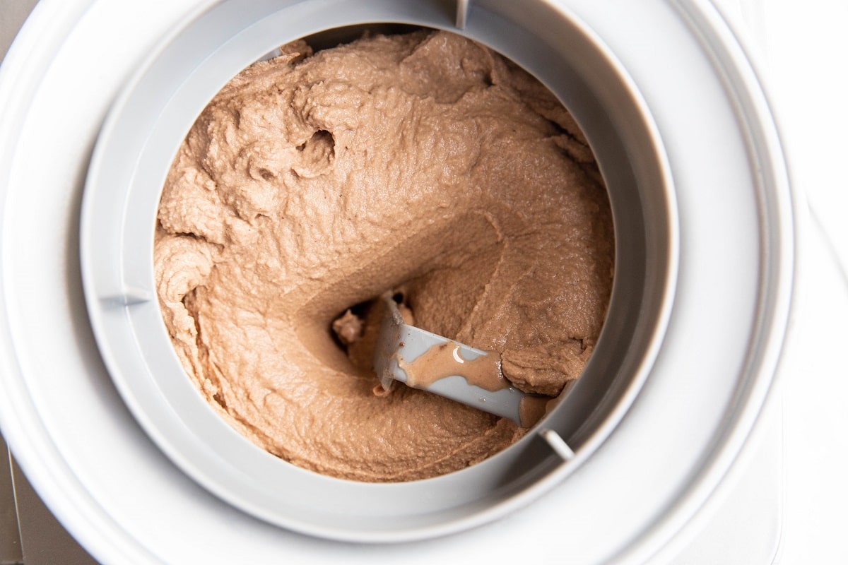 Chocolate ice cream in an ice cream maker.