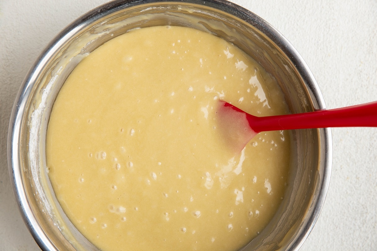 Smooth vanilla cake batter in a mixing bowl, ready to be baked.