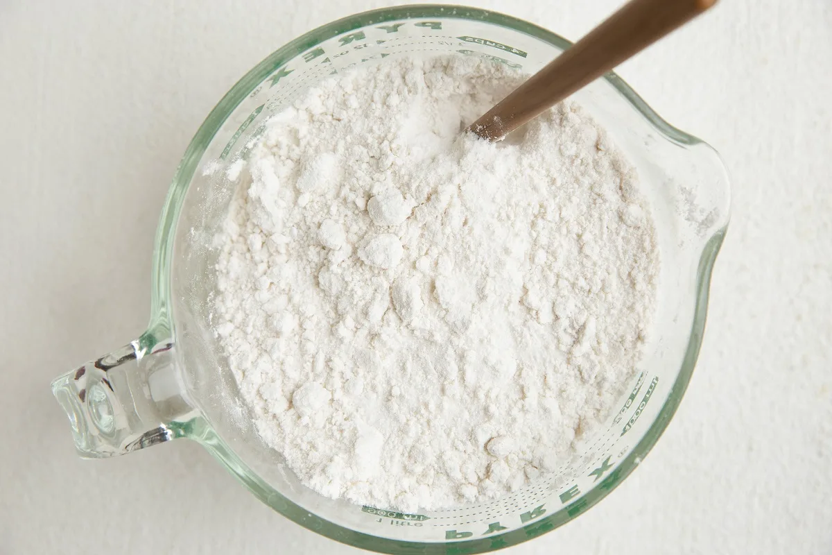 Dry ingredients for vanilla cake in a mixing bowl.