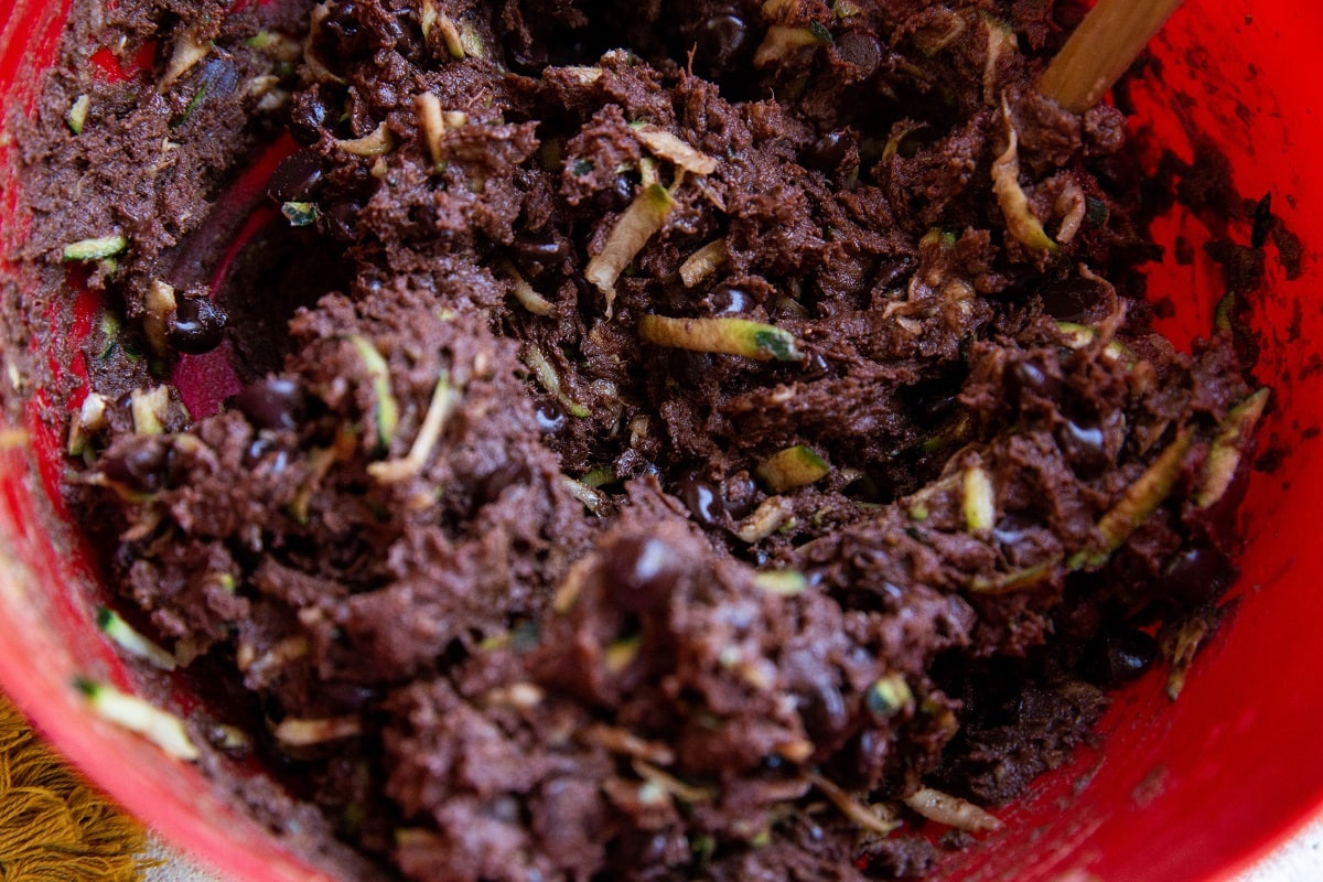 Zucchini brownie batter in a mixing bowl, ready to be baked.