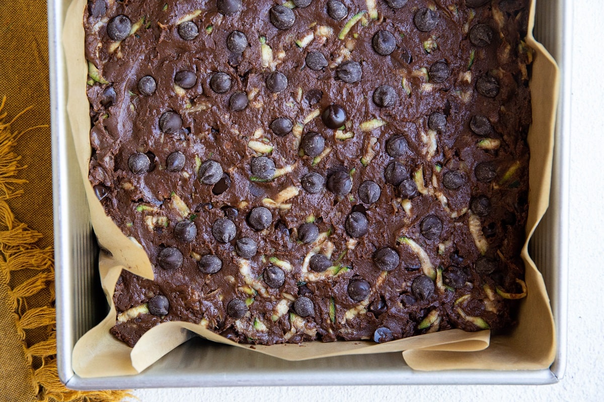 Brownie batter in a prepared baking dish, ready to go into the oven.