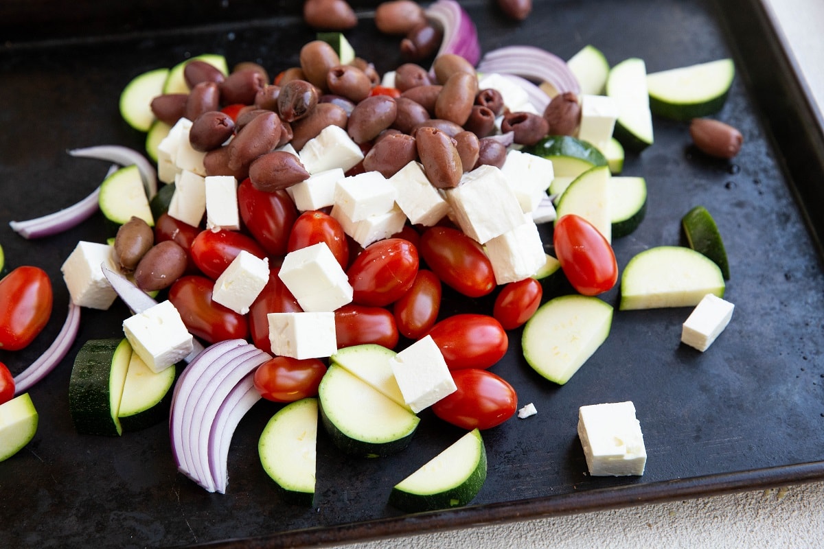 Vegetables on a baking sheet for sheet pan shrimp recipe.