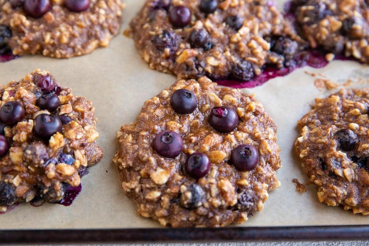 Freshly baked blueberry banana cookies on a baking sheet.