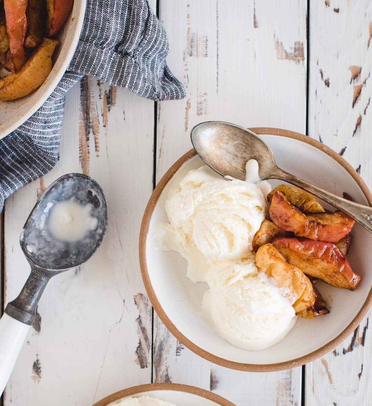 Apples in a bowl with ice cream.