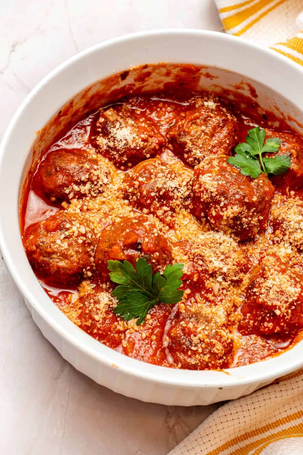 Meatballs in tomato sauce in a serving dish.
