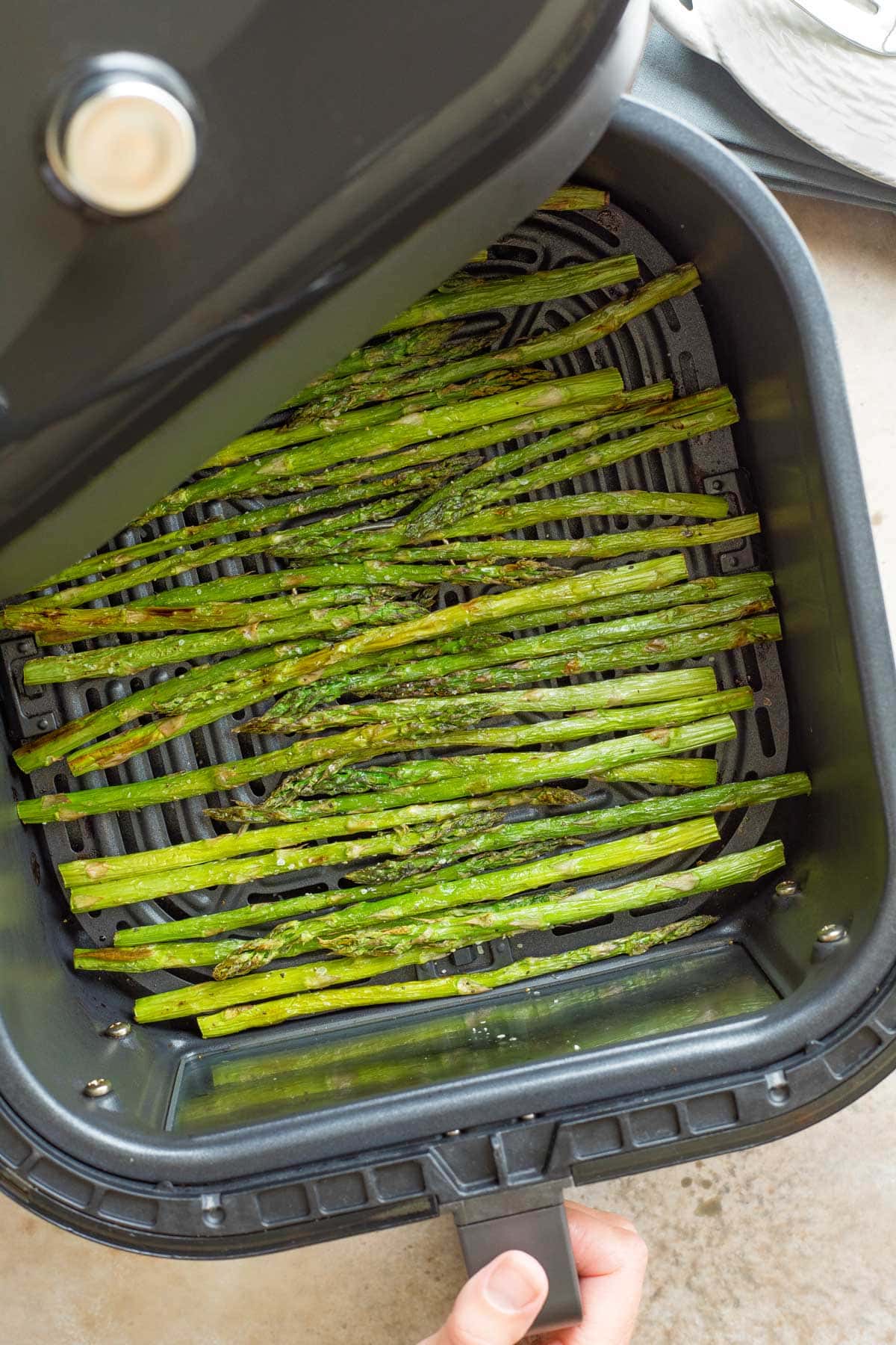 Cooked asparagus in an air fryer