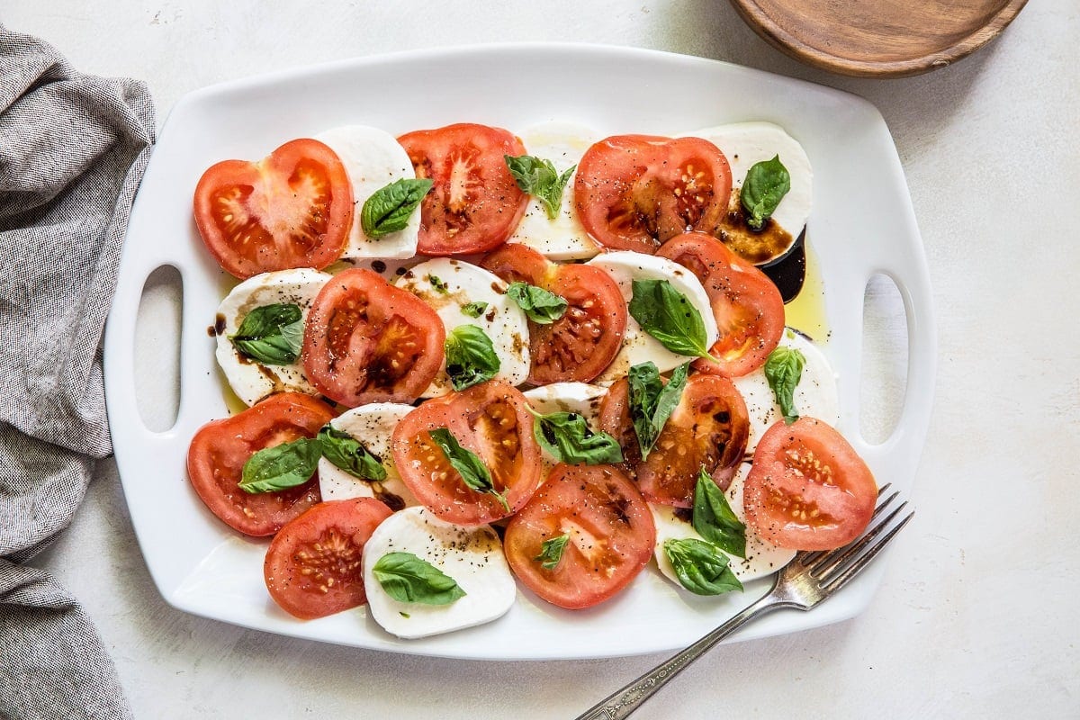 White serving plate of caprese salad