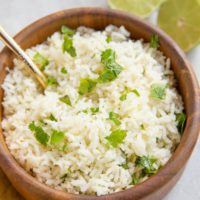 Wooden bowl of cilantro lime rice.