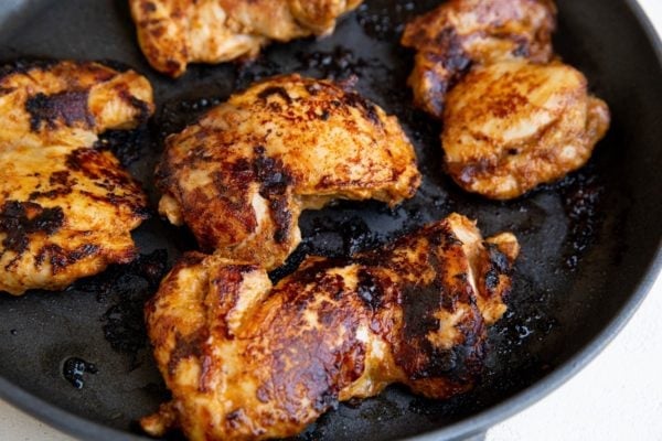 Cooked chicken in a skillet.