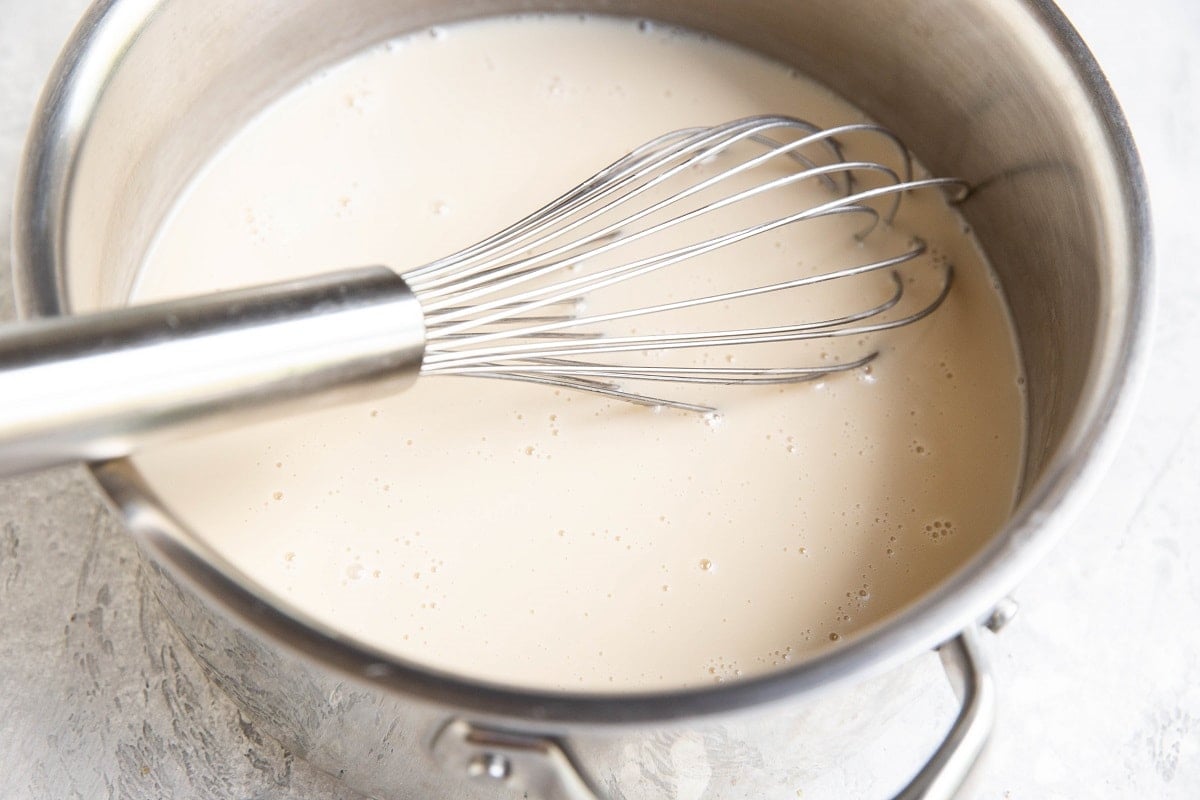 Vanilla ice cream base in a saucepan.