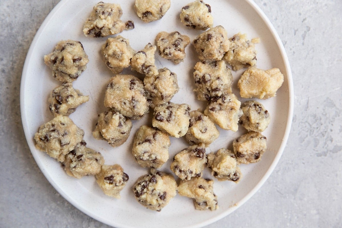 Cookie dough balls on a plate.