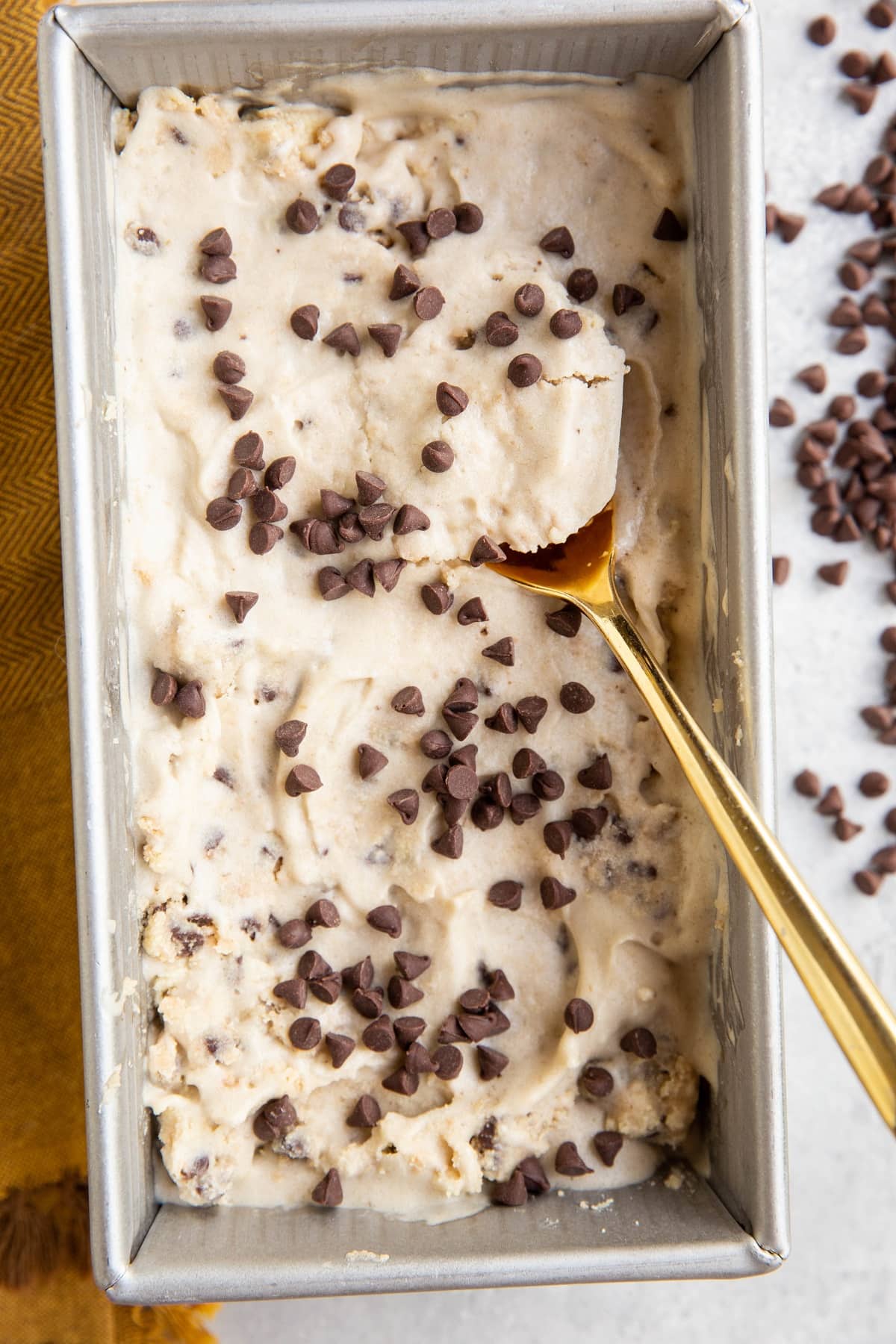 Loaf pan of vegan cookie dough ice cream.