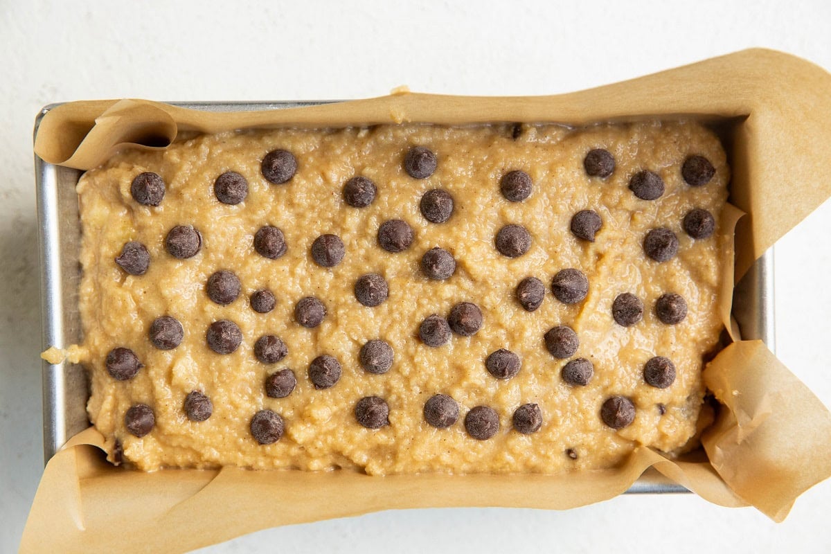 Banana bread batter in a loaf pan, ready to be baked.