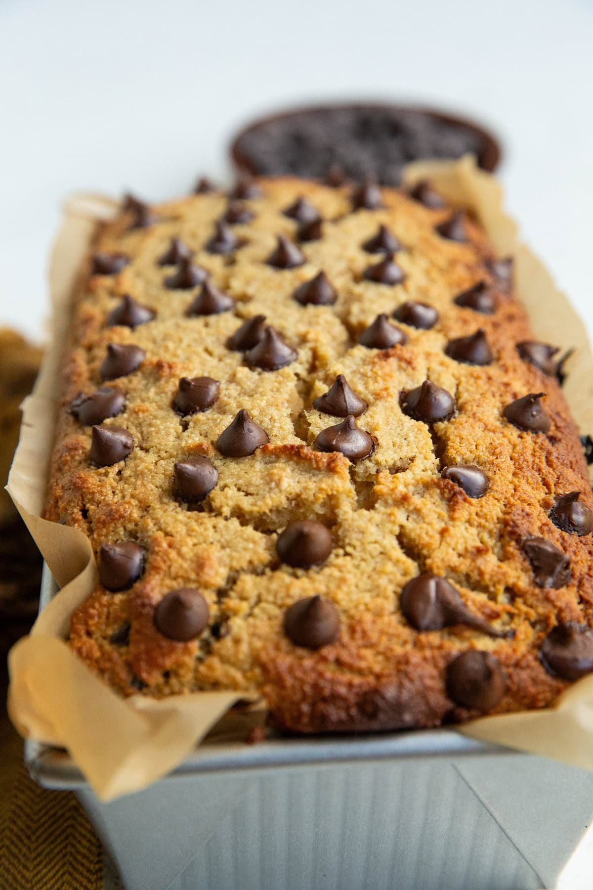 Chocolate chip Almond flour banana bread in a loaf pan, fresh out of the oven.